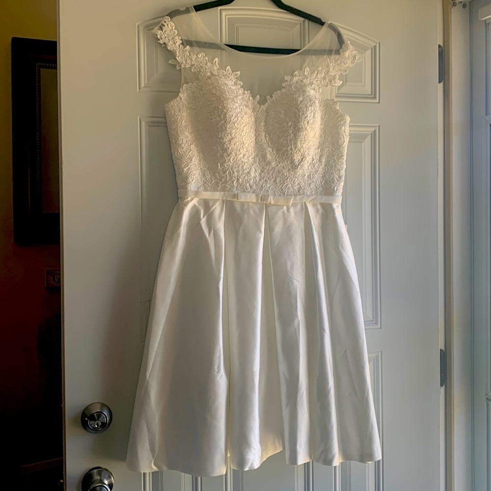 New with tags. White wedding dress. Satin/lace. Back has lace corset tie.